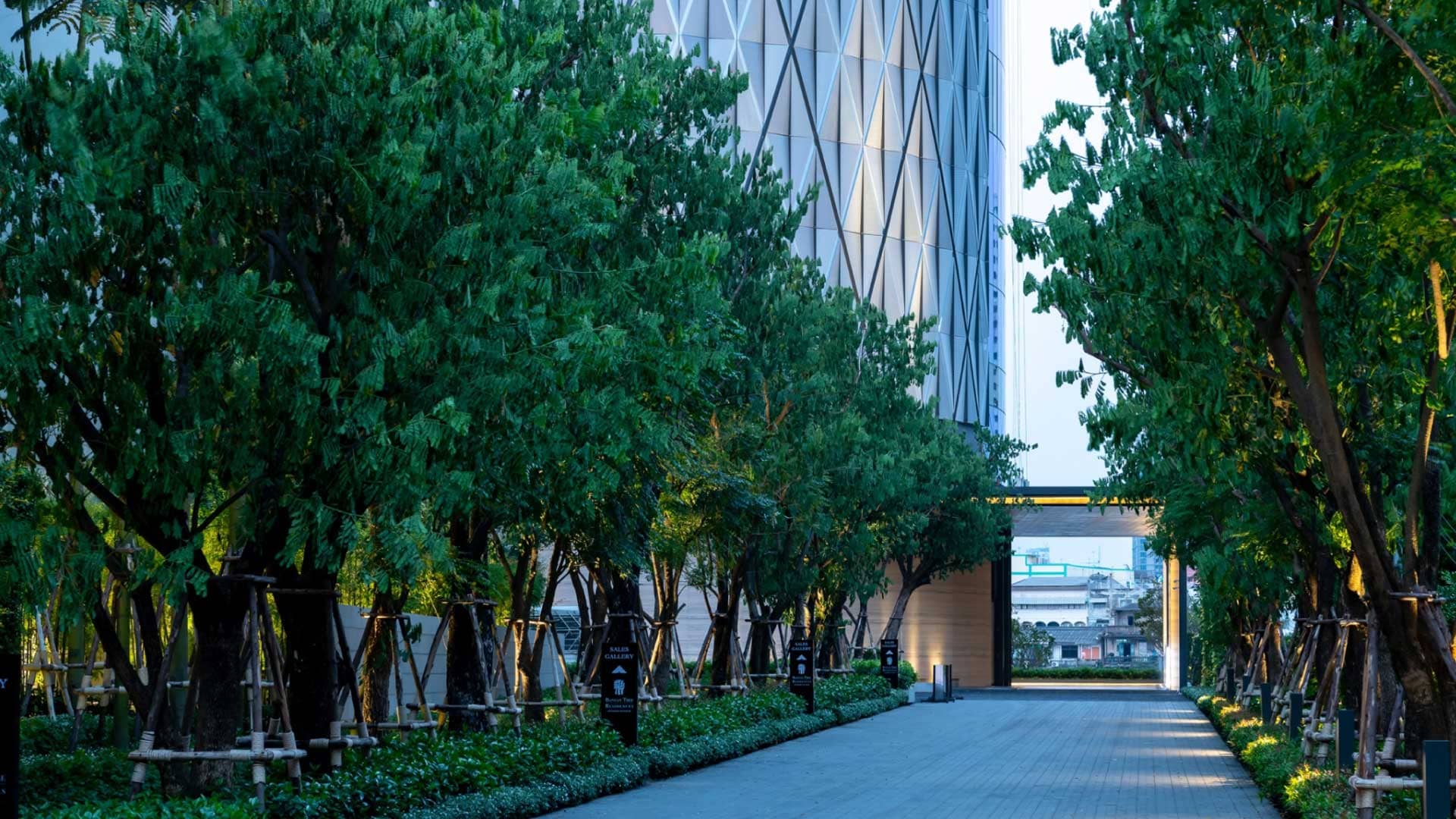 Banyan Tree Residences Riverside Bangkok tree-lined entrance walkway