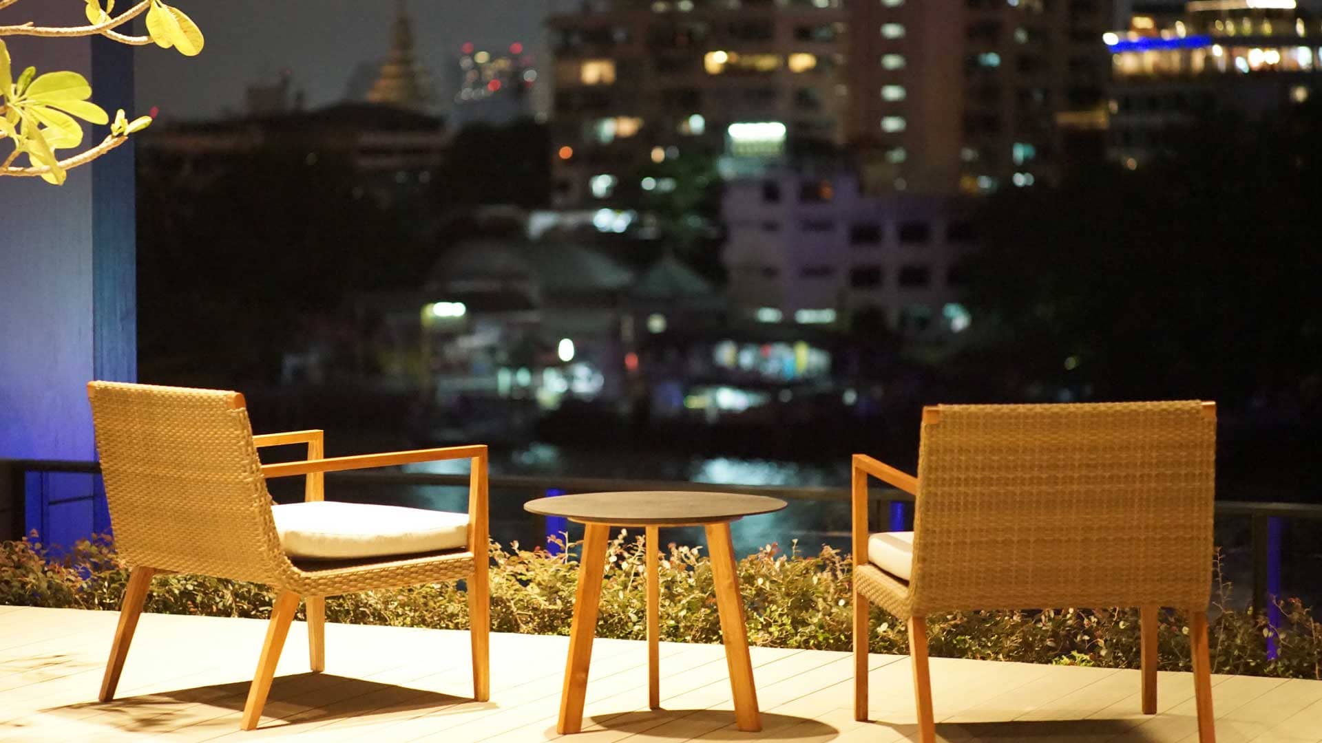 Banyan Tree Residences Riverside Bangkok riverside terrace seating at night
