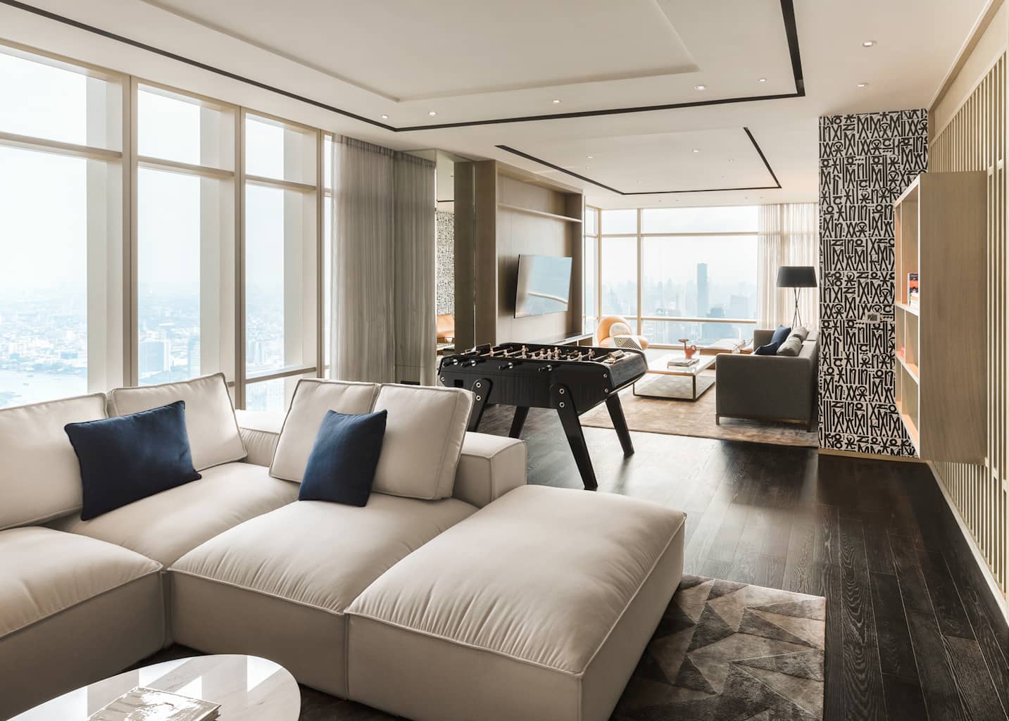 Four Seasons Private Residences Bangkok residents lounge with games table and city view, rendering