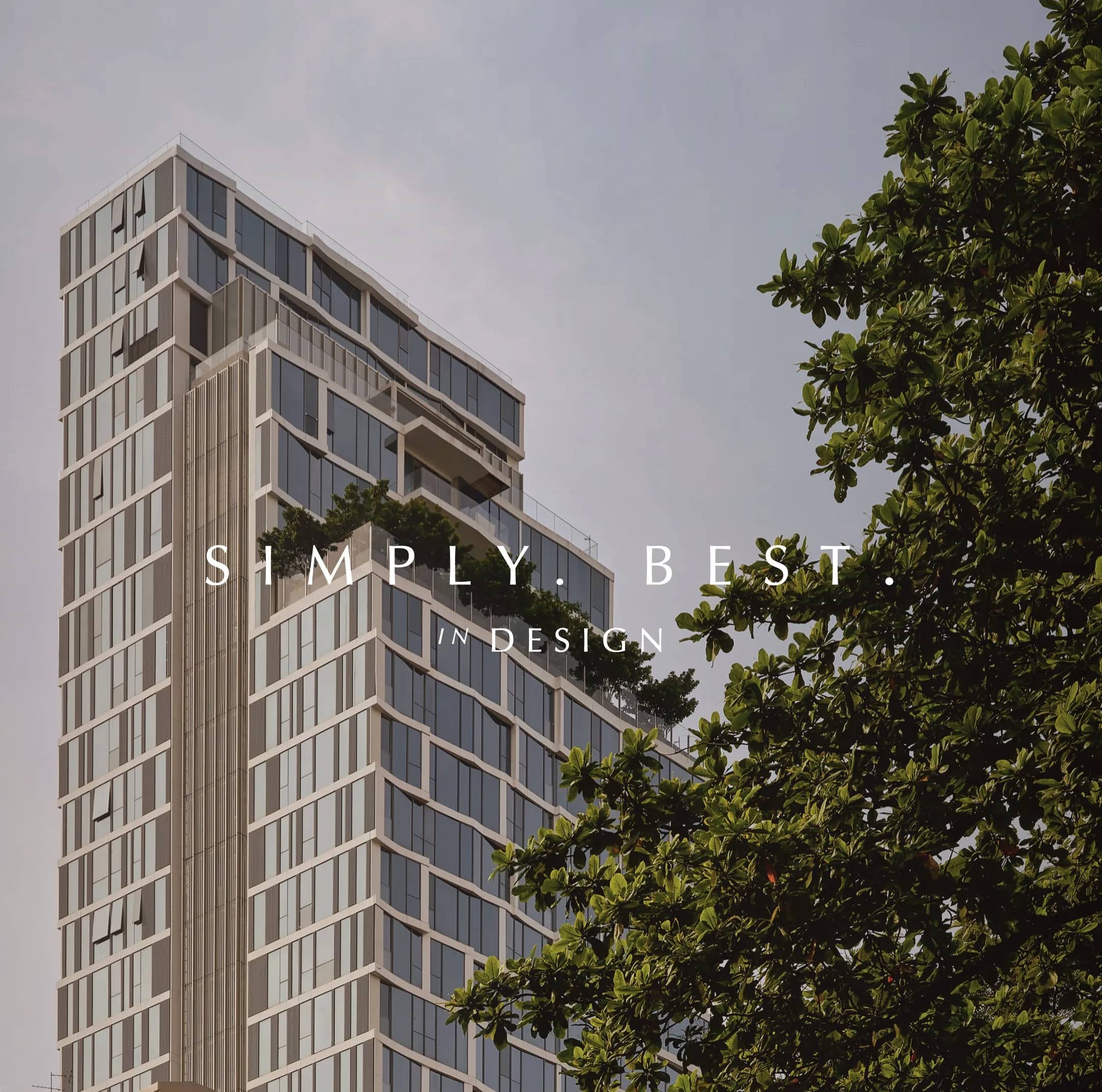 SCOPE Langsuan facade seen from street level with trees