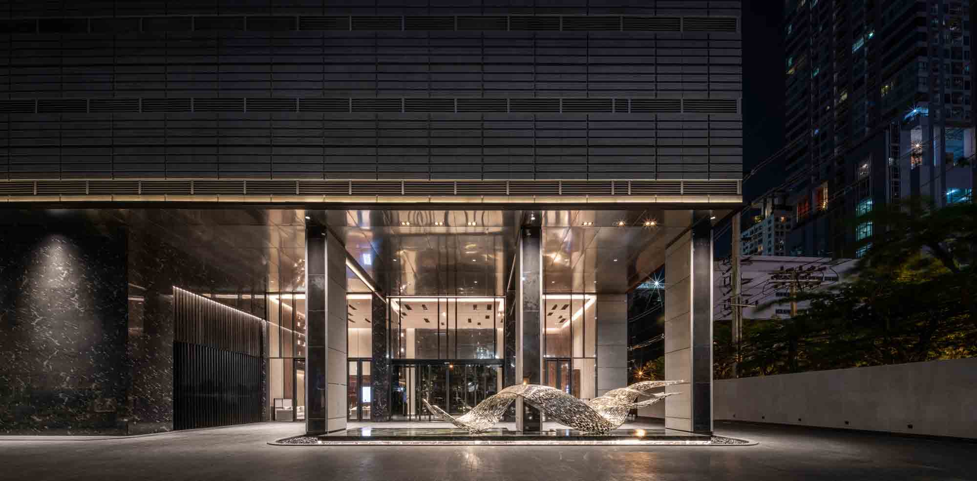 Anil Sathorn 12 entrance at night published by Grand Unity