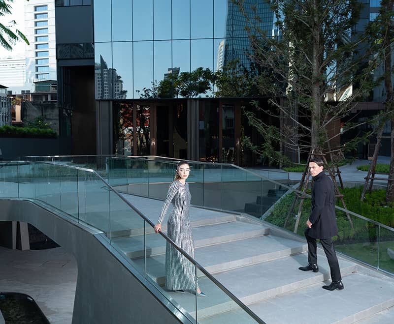 Ashton Silom landscaped terrace with glass-railed stairway
