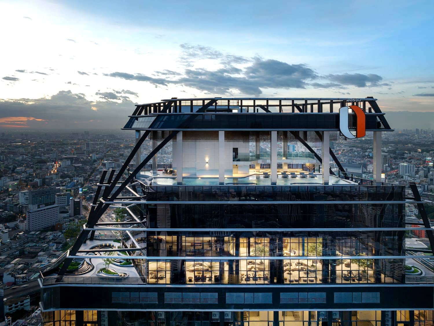 Park Origin Chula-Samyan exterior at sunset showing the sky deck และ steel bracing