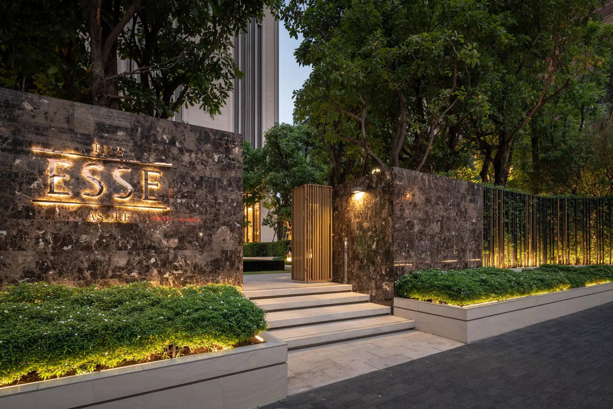 The Esse Asoke entrance with project signage at dusk