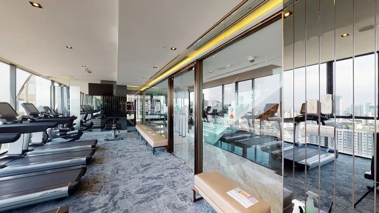 The Esse at Singha Complex fitness centre with city view