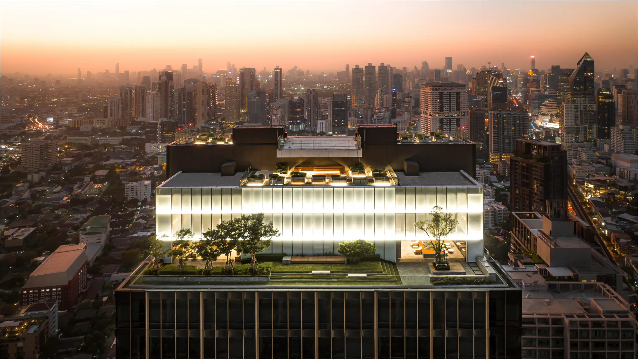 The Esse Sukhumvit 36 upper floors and roof garden at dusk