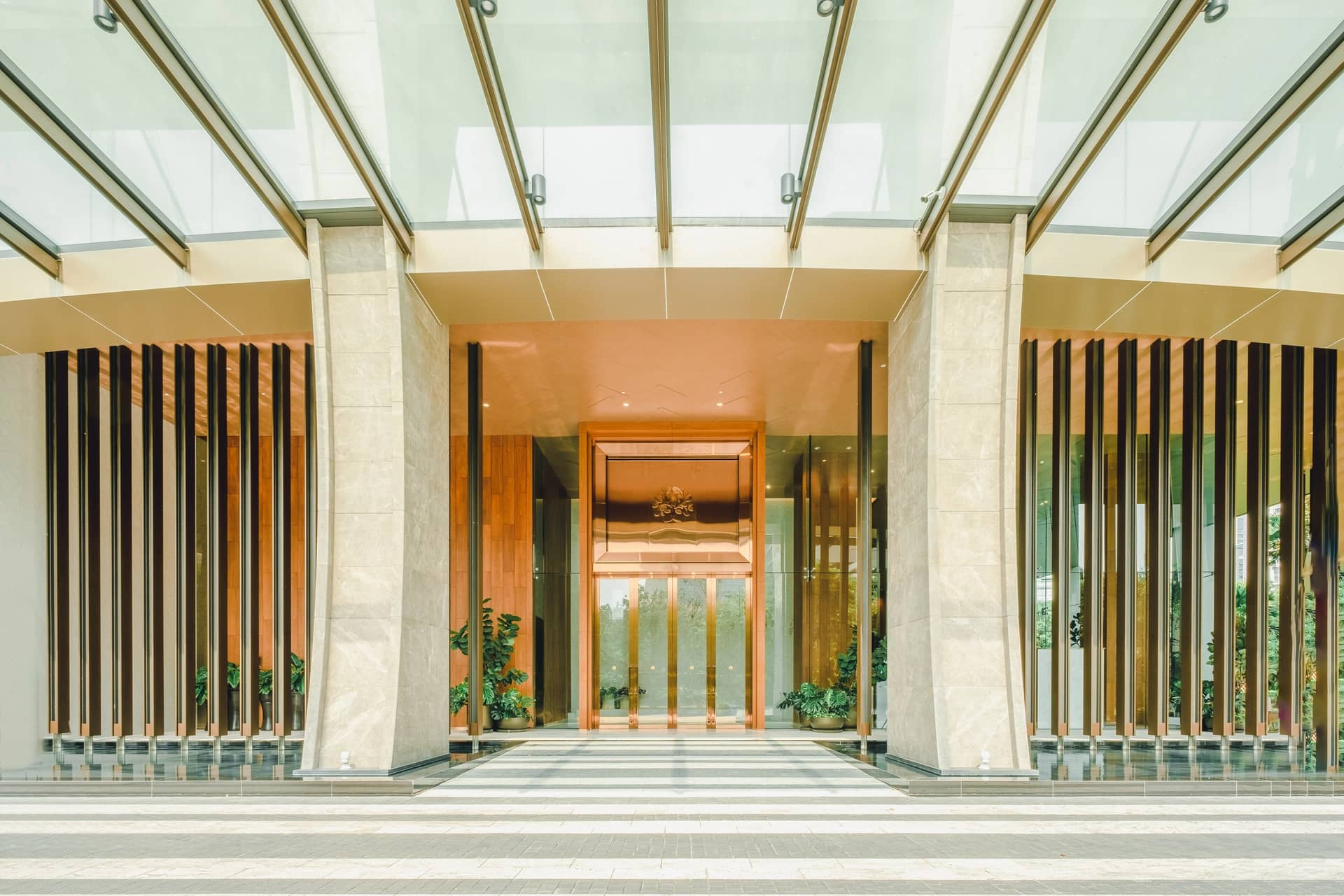 The Residences at Sindhorn Kempinski Hotel Bangkok building entrance with glass canopy
