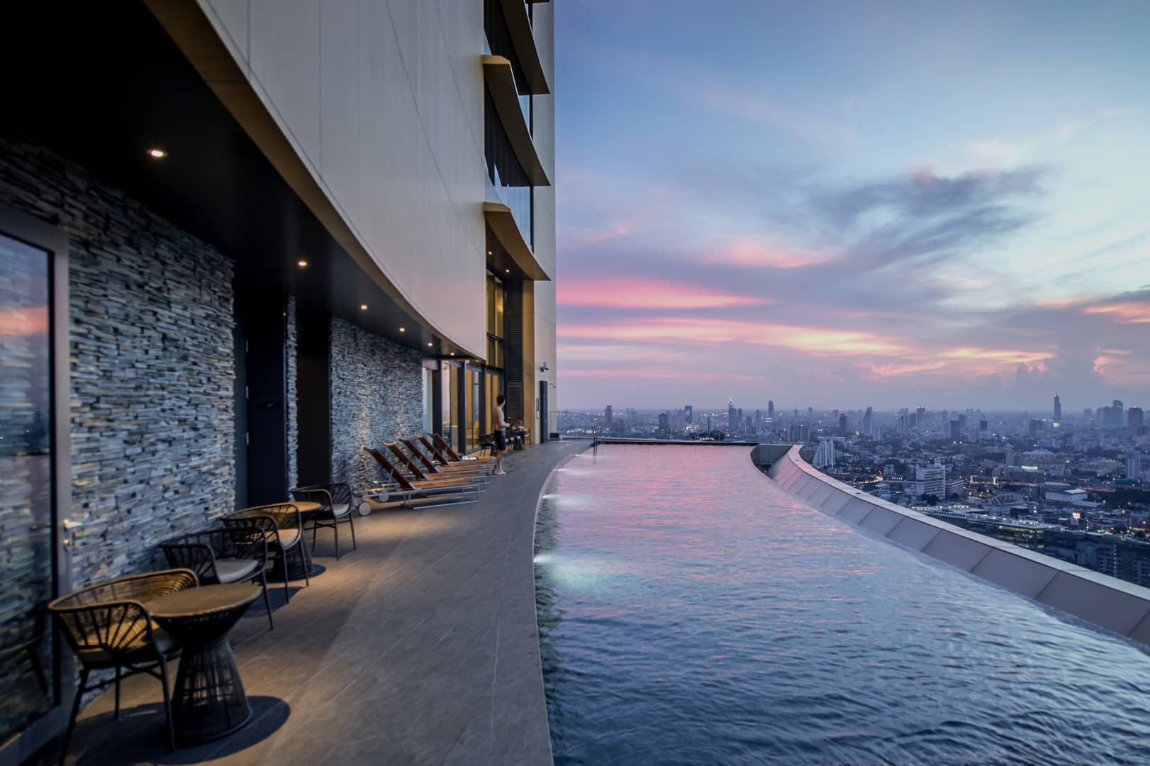 The Lumpini 24 infinity pool overlooking Bangkok at dusk