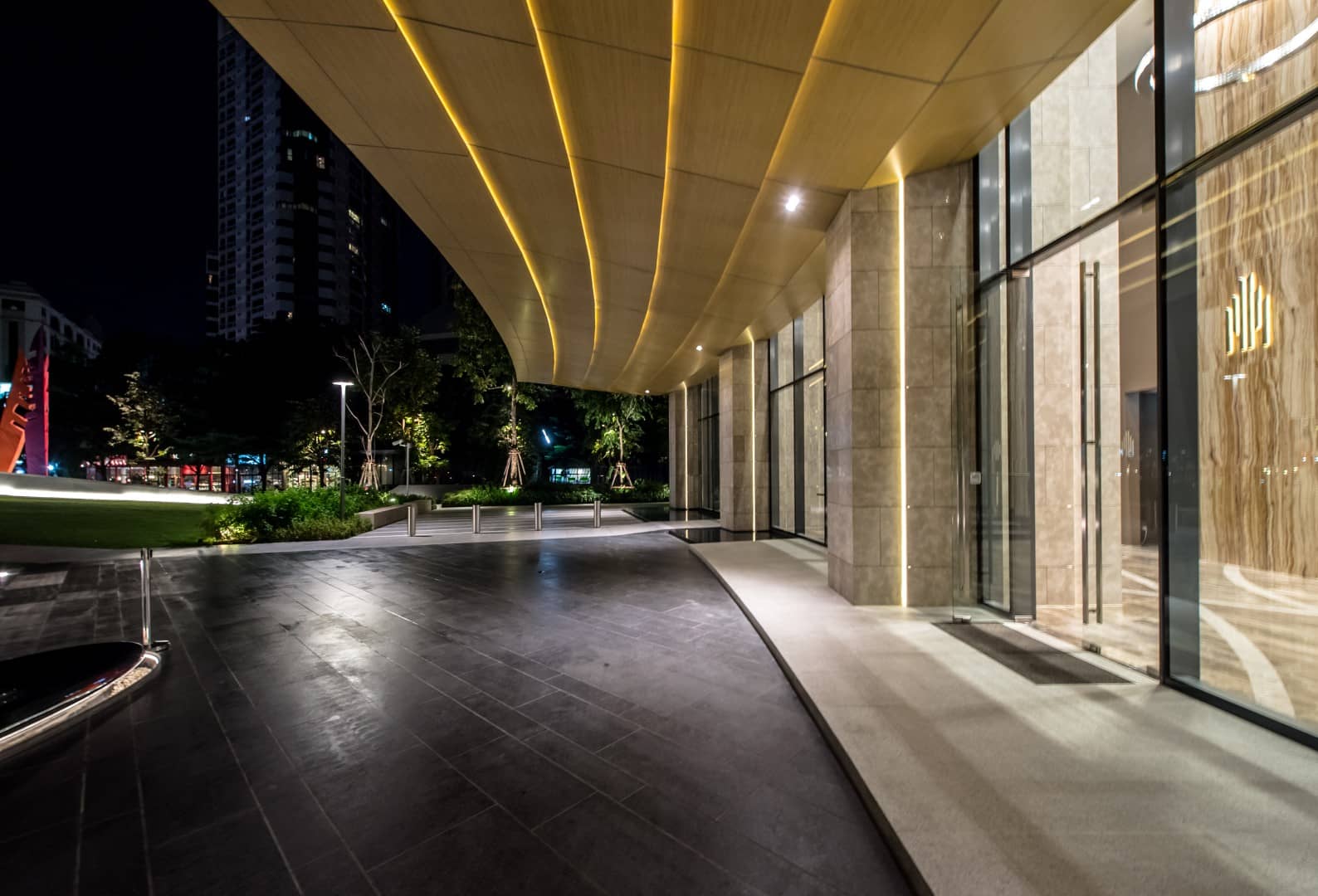 The Lumpini 24 covered entrance at night