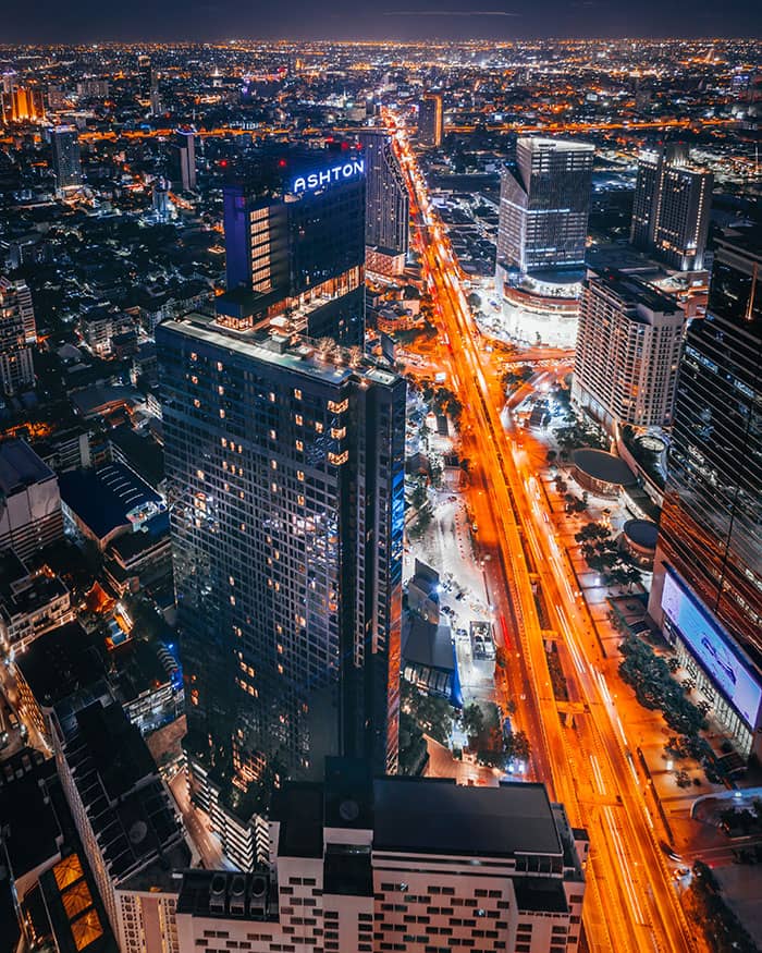 Ashton Chula Silom tower and surrounding city at night