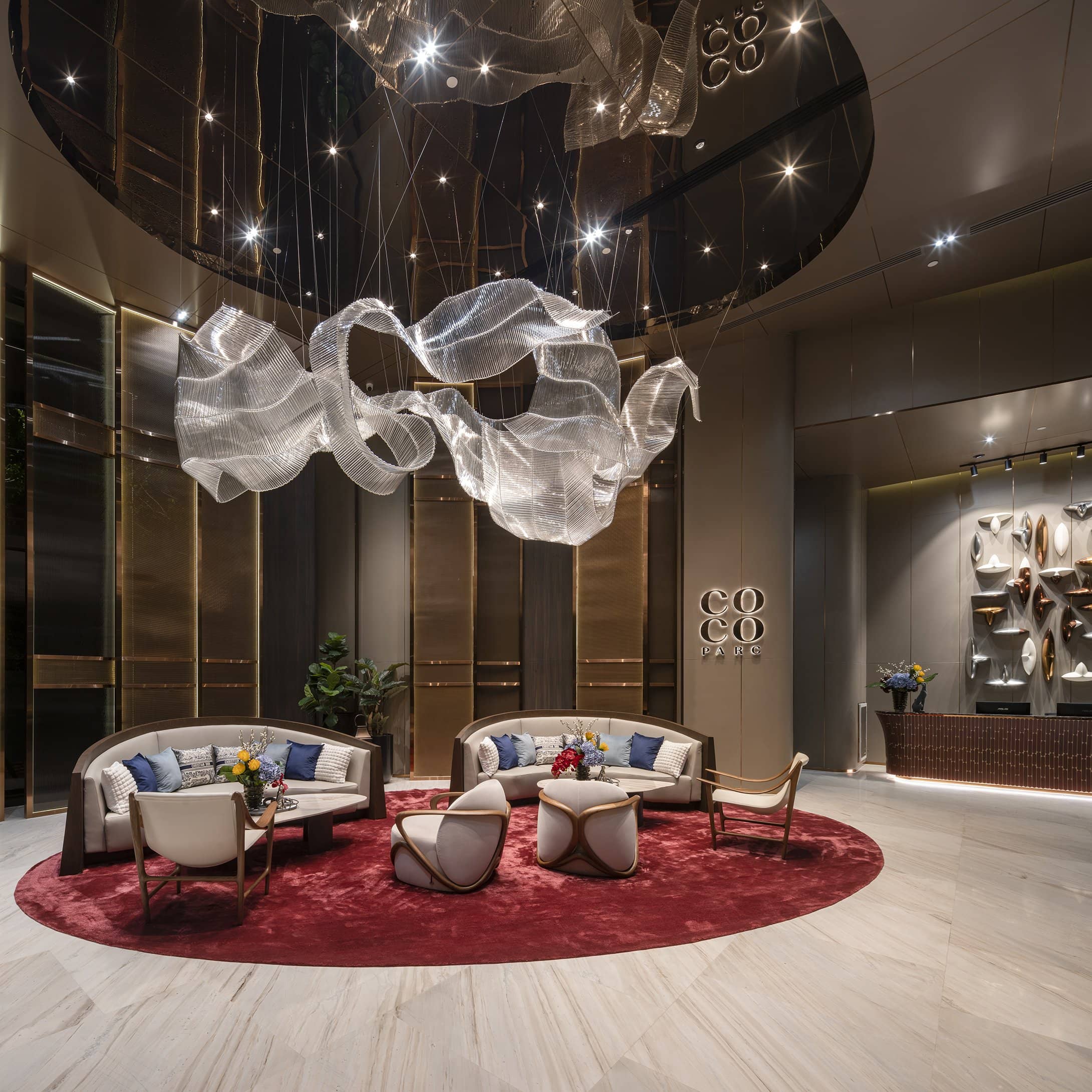COCO Parc lobby seating and sculptural lighting published by Ananda Development
