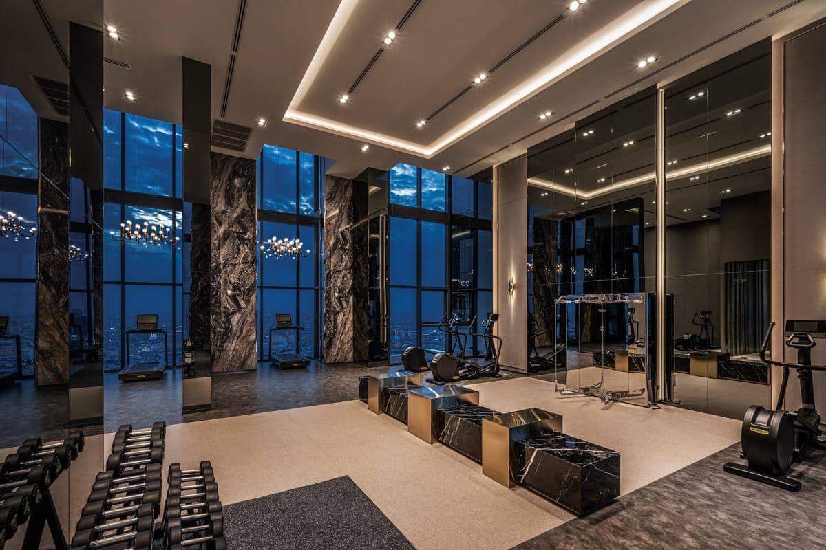 The Address Siam fitness center with cardio machines and weight racks