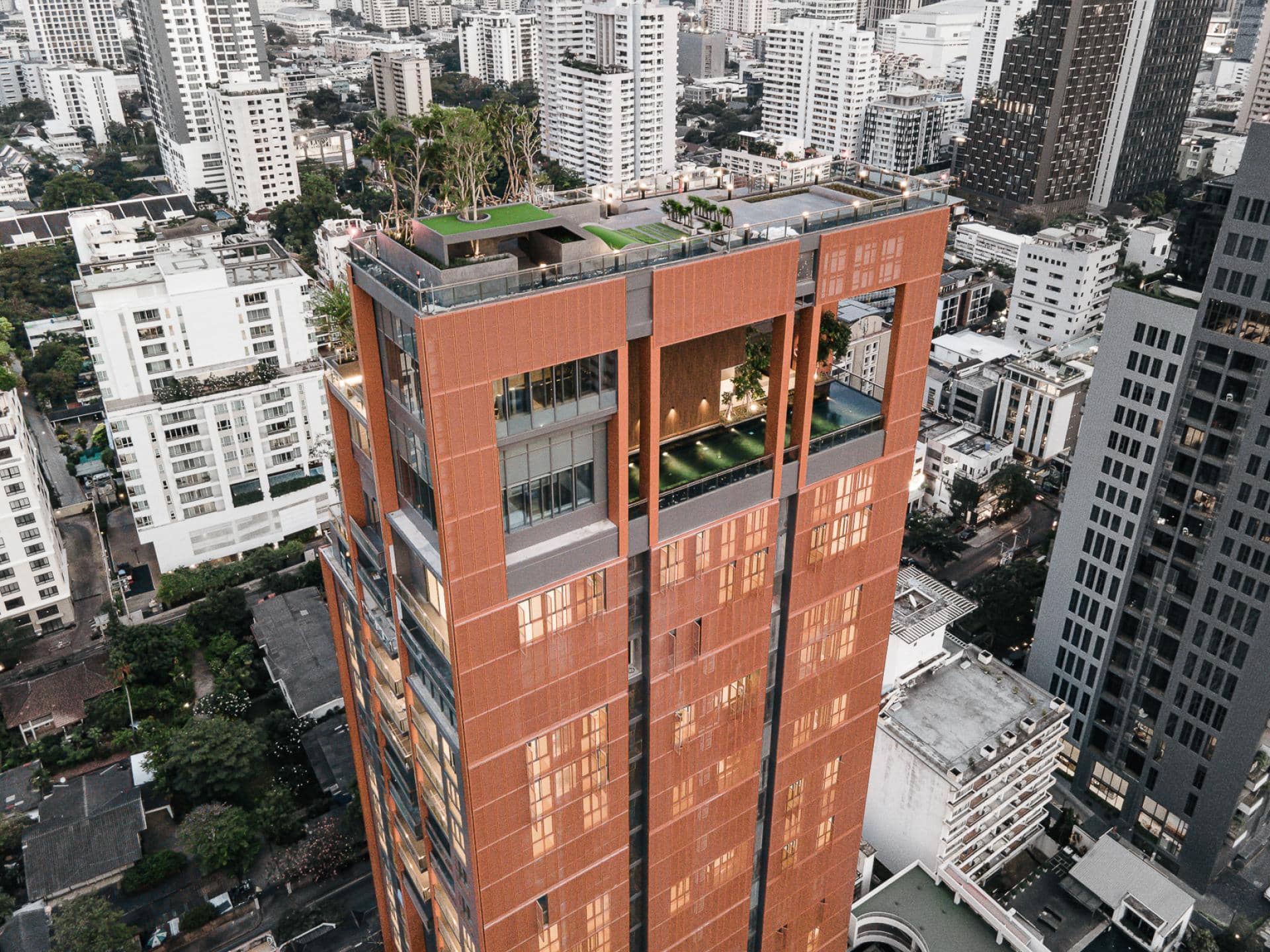 Circle Sukhumvit 31 aerial view of the copper-toned tower and rooftop garden