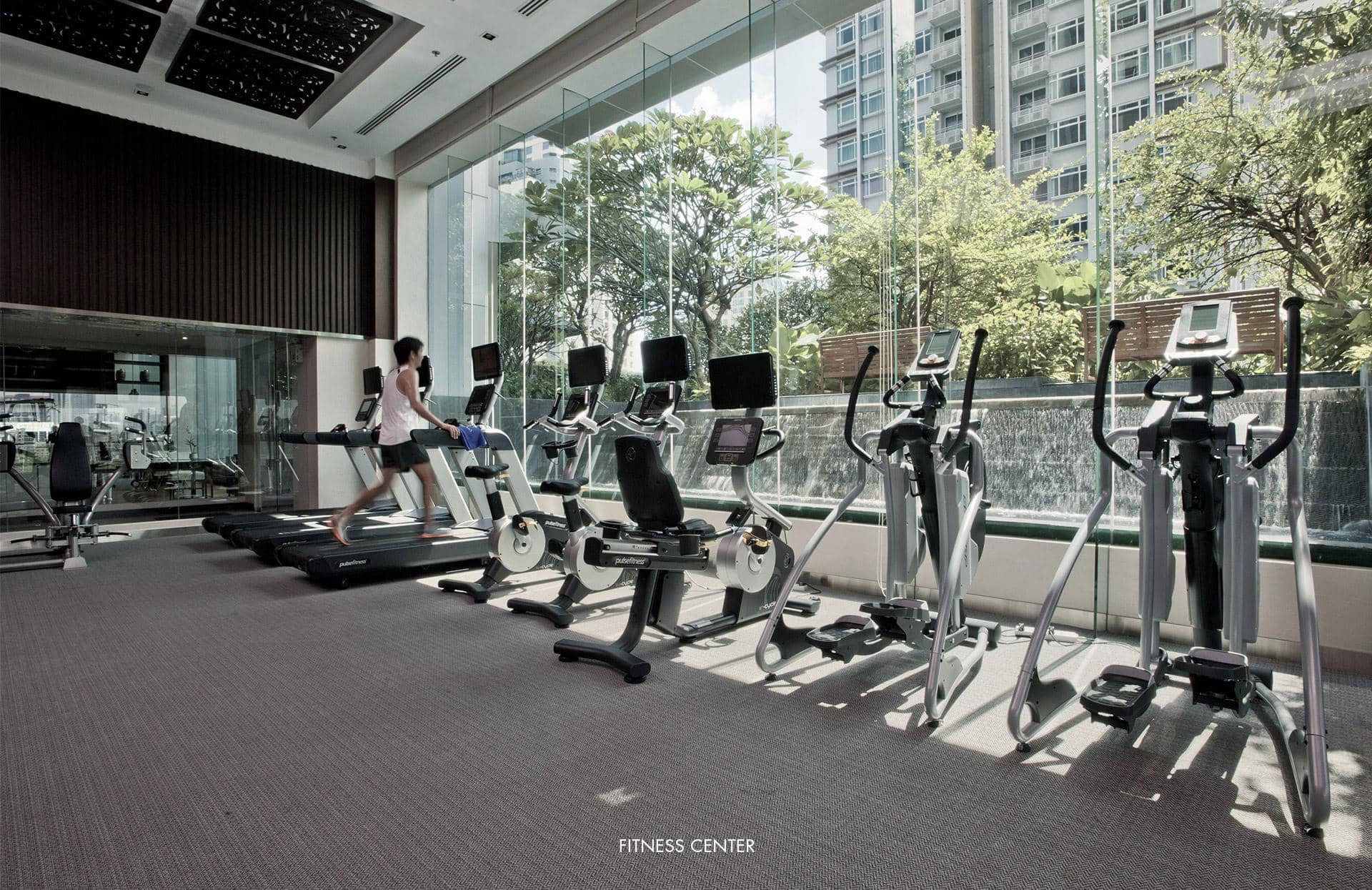 Circle Condominium fitness centre overlooking its landscaped grounds