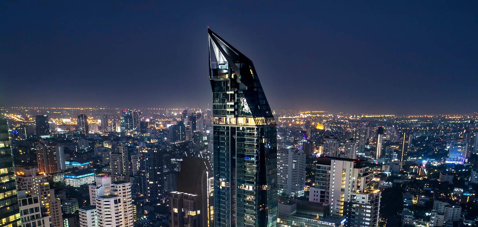 Marque Sukhumvit tower at night above the Sukhumvit skyline