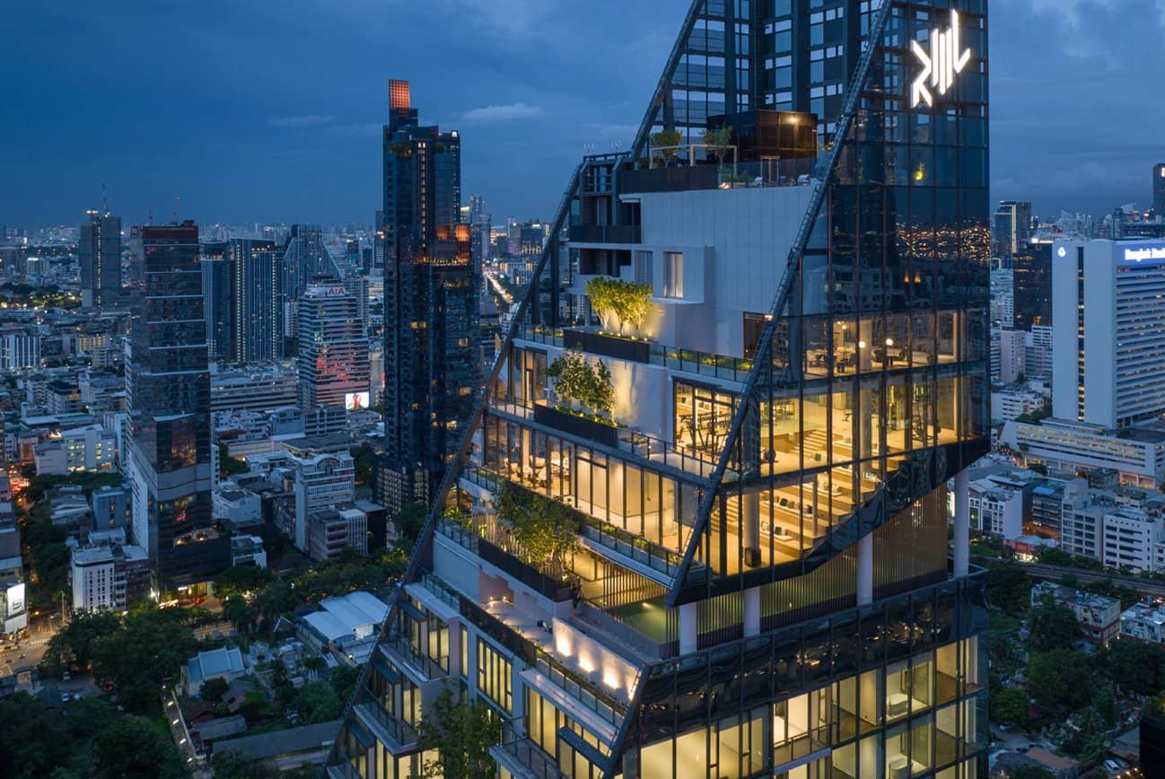 Tait Sathorn 12 upper floors lit at dusk