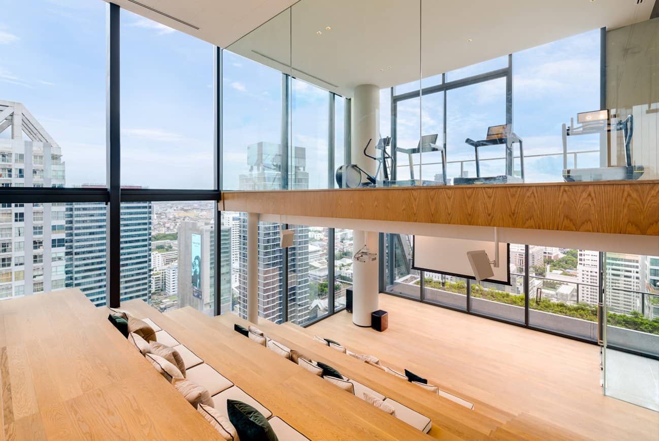 Double-height gym overlooking the city