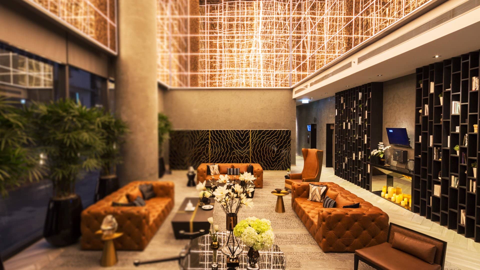 Residents' lounge with library wall