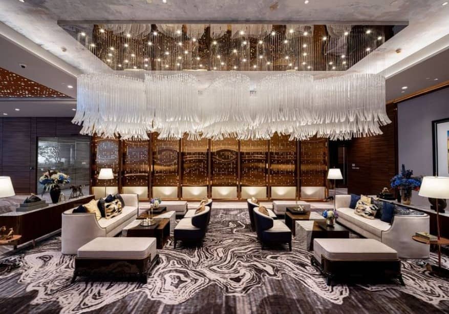 Supalai Icon Sathorn lobby lounge with chandelier and sofas