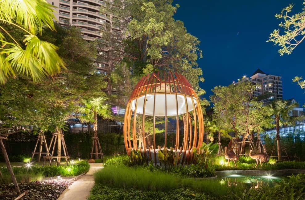 Supalai Icon Sathorn landscaped garden with lit pavilion at night