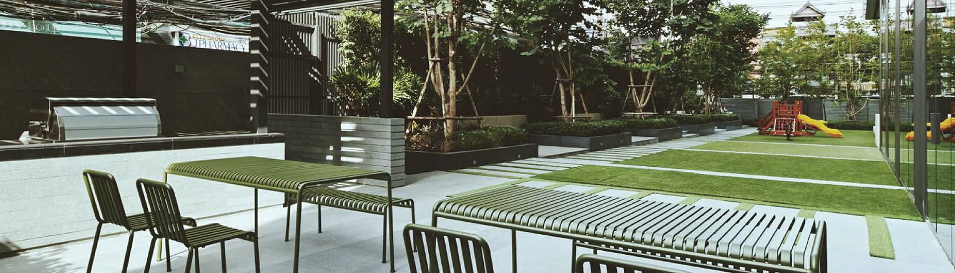 Tela Thonglor garden lawn with seating and play area