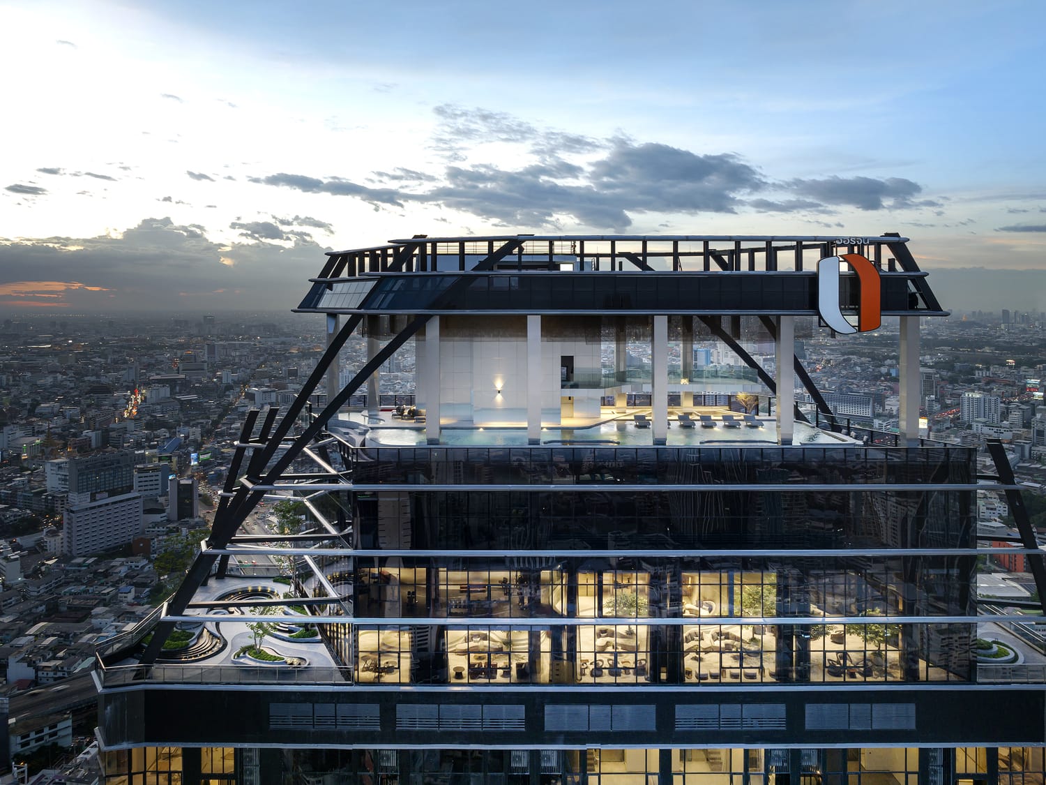 Park Origin Chula-Samyan exterior at sunset showing the sky deck and steel bracing