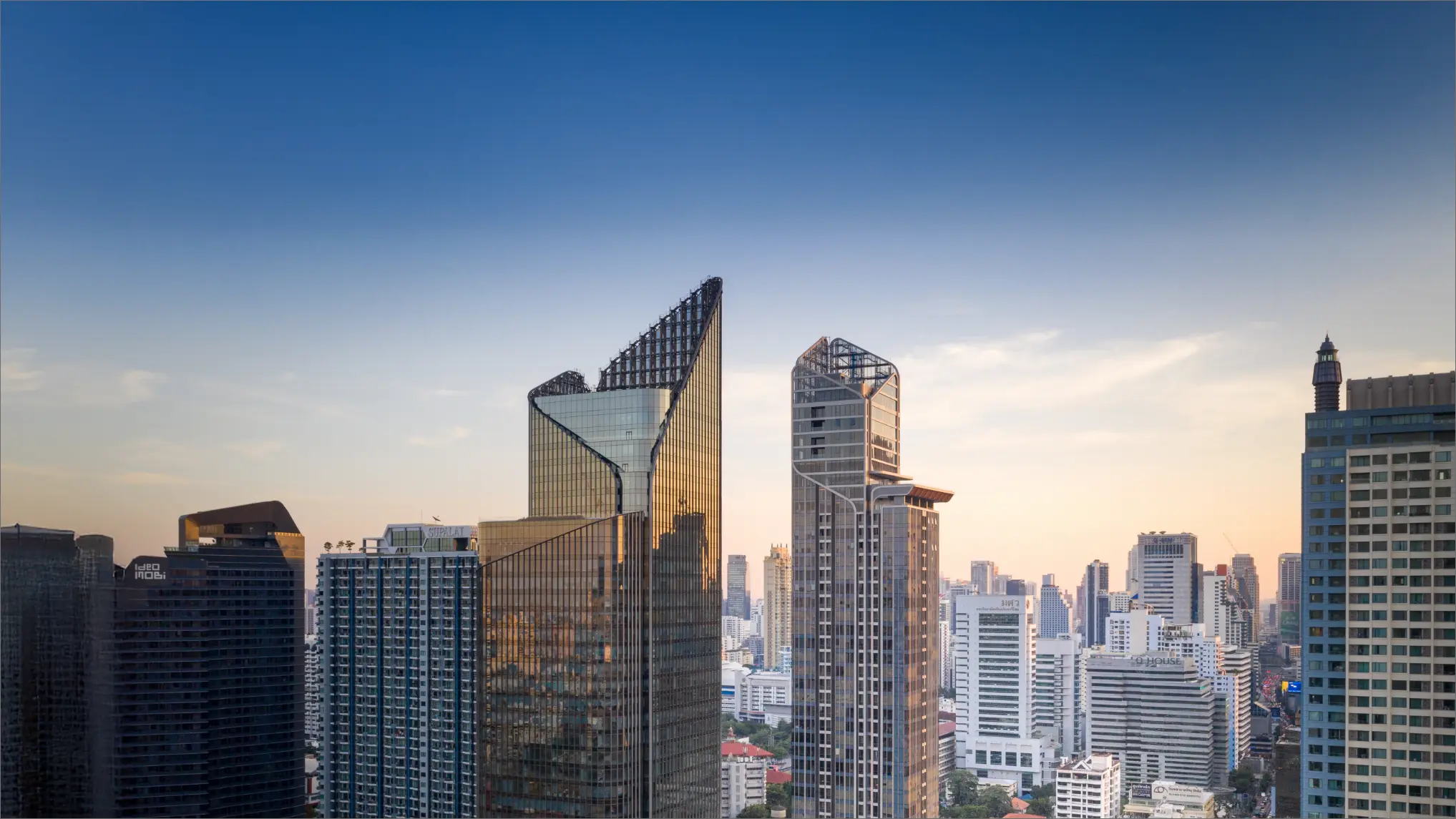 The Esse at Singha Complex tower and Singha Complex office tower at dusk