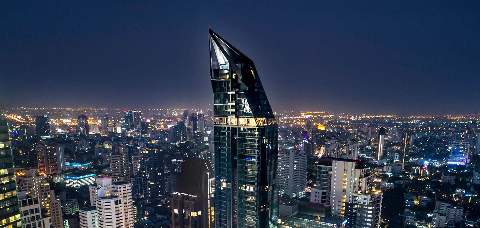 Marque Sukhumvit tower at night above the Sukhumvit skyline