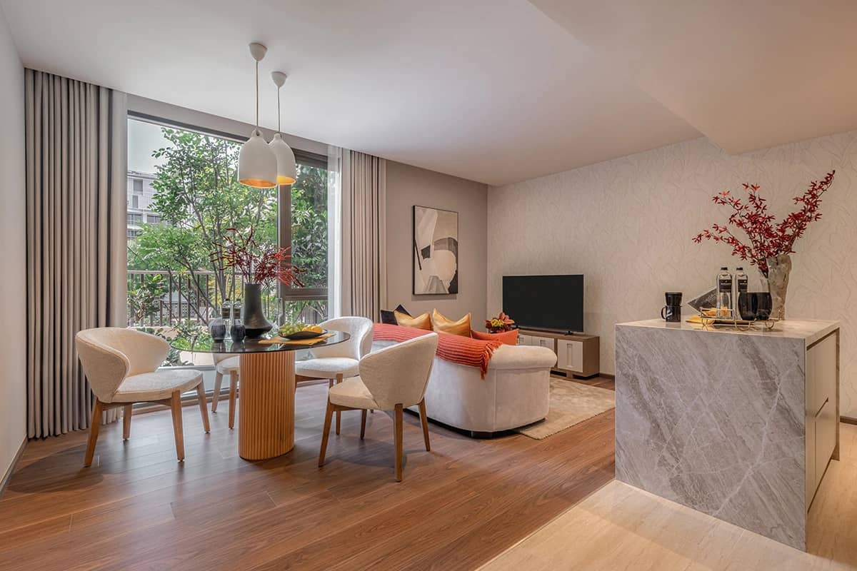 Via 61 show residence living room with open kitchen and dining table