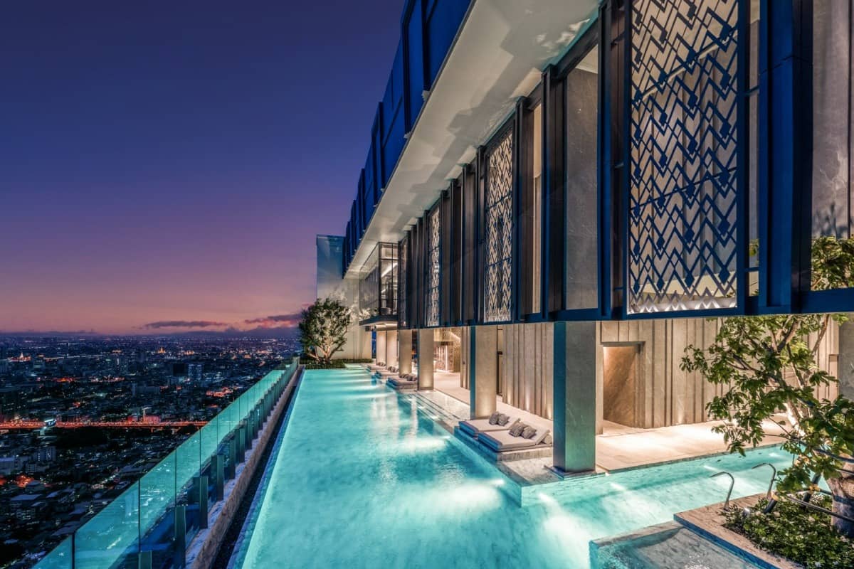 The Address Siam rooftop infinity pool at dusk with city view